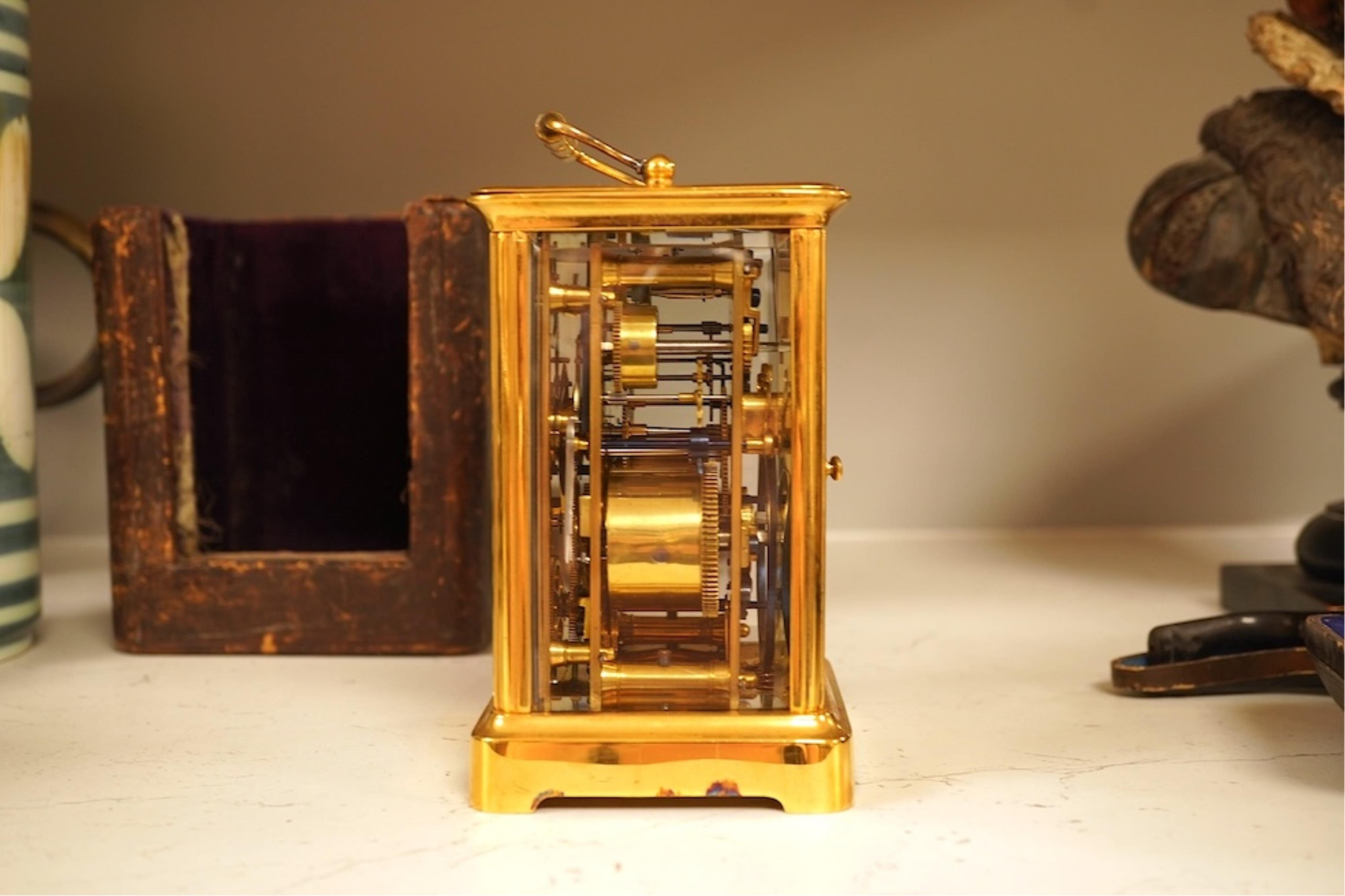 A French carriage clock with alarm, gong-striking movement, in a contemporary leather case, 17cm high